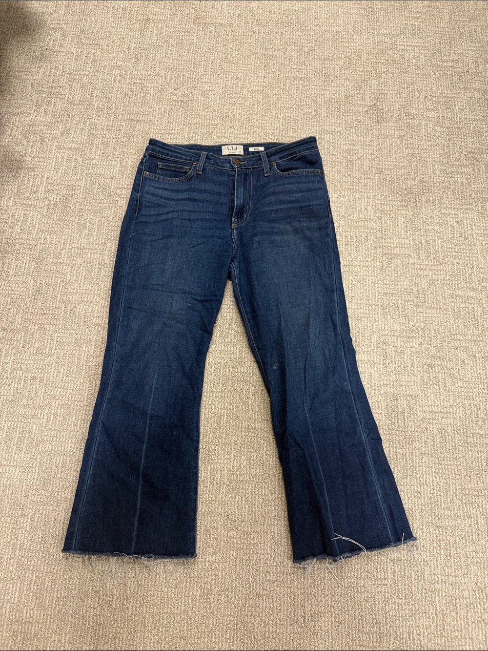 High-Rise Dark Blue Flare Jeans with Raw Hem